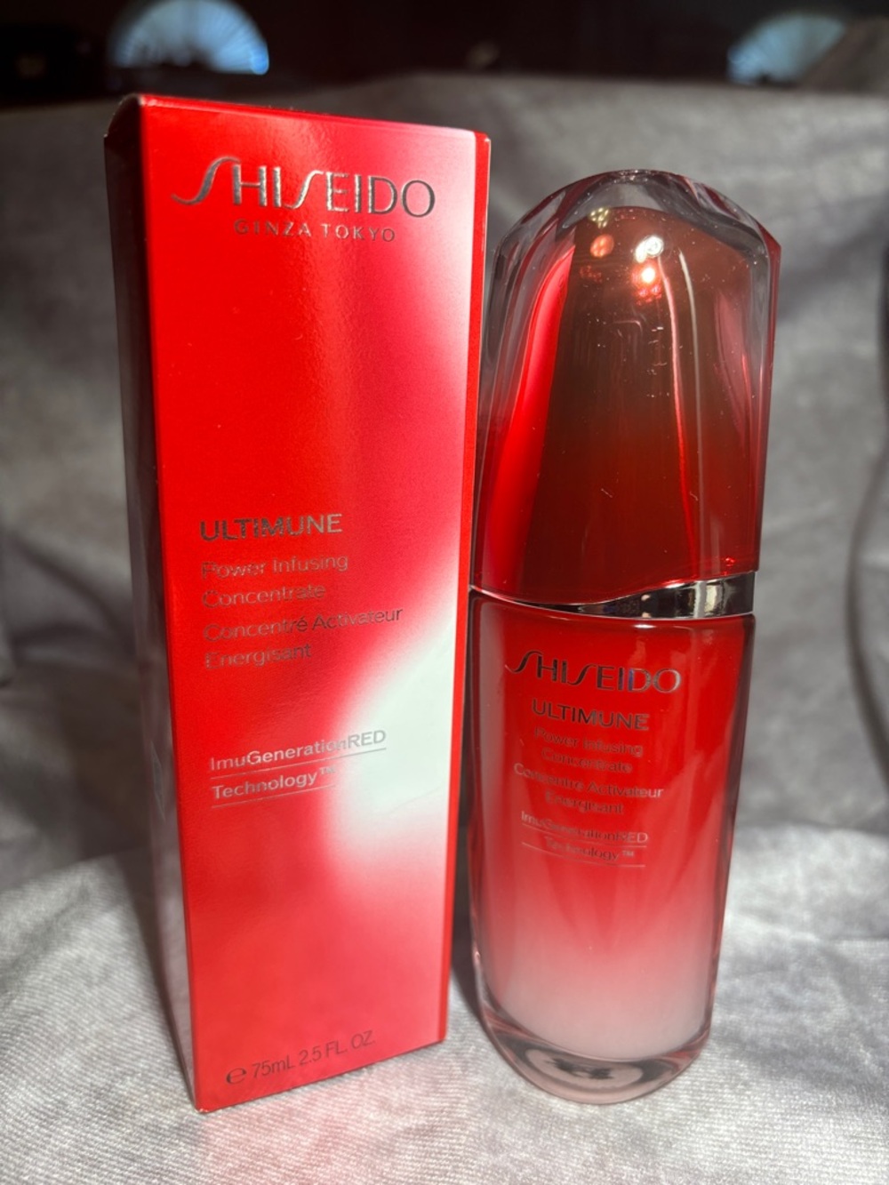 Shiseido Ultimune Serum - Vibrant Red and Silver Accents